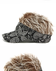 Close-up of black paisley visor hat with light brown messy wig hair detail on top