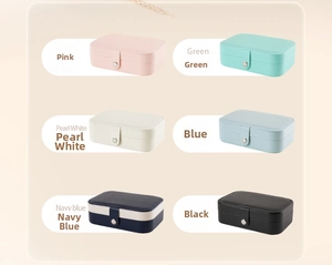 Portable small travel jewelry box organizer with snap closure for rings, earrings and necklaces.