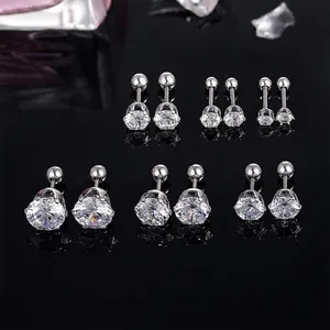 Set of stainless steel cubic zirconia stud earrings with screw-back design on black base