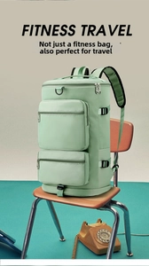 Close-up of mint green travel bag with side buckles on a vintage wooden chair