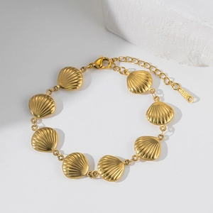 Golden stainless steel bracelet with shell-shaped metal links on a clean white background
