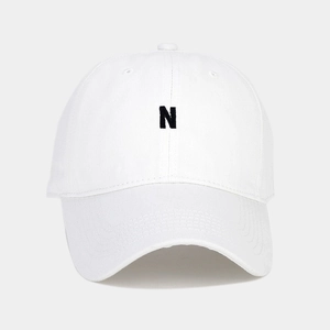 Close-up of black letter N embroidery on high-quality white cotton twill baseball cap