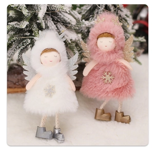 Detailed view of pink and white plush angel dolls with snowflake accents on Christmas tree