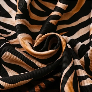 Macro detail of zebra print fabric with woven texture and subtle glossy finish
