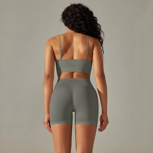 Close-up of seamless ribbed back design on gray-green yoga bra and leggings set