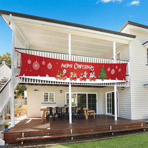 Outdoor Merry Christmas banner with Santa Claus on a red balcony decoration