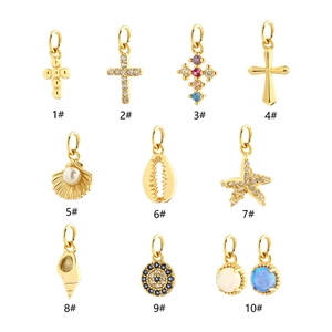 Collection of gold-plated sterling silver pendants with shell, star and cross designs