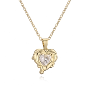 Gold heart pendant necklace with clear zircon and lava texture metal on white background
