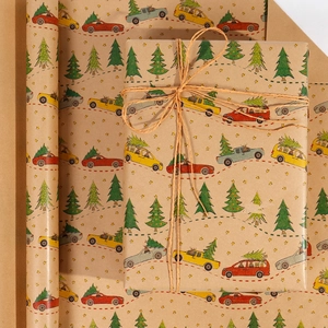 Detail showing vintage kraft Christmas wrapping paper with tree patterns and twine cord