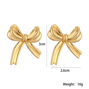 Detailed view of gold bow earrings with precise 3cm x 2.6cm size and 10g weight specifications