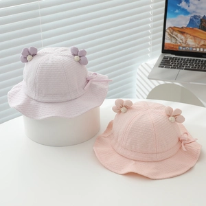 Solid color baby sun hats with floral accent in soft purple and pink shades