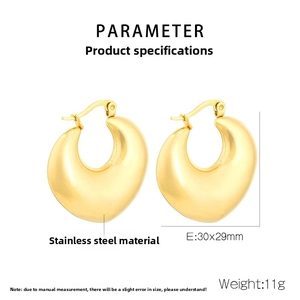 Detail view of gold teardrop earrings with dimensions 30x29mm and stainless steel texture