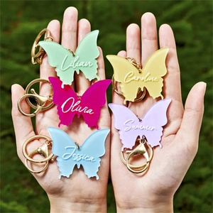 Customized butterfly acrylic keychains in vibrant macaron colors with golden metal rings