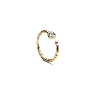 Macro shot of gold-plated stainless steel C-shaped nose ring with a sparkling zircon