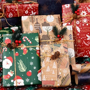 Foldable Christmas gift wrapping paper set with Santa, snowflakes, jute rope, and pine cones