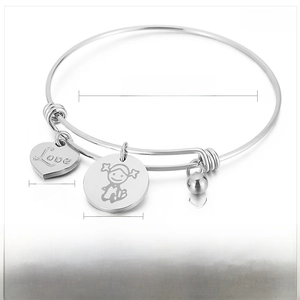Detail of adjustable stainless steel bangle with Love heart and girl charms, 68mm diameter