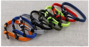 Close-up of colorful braided rope bracelets with durable black plastic buckles and connectors