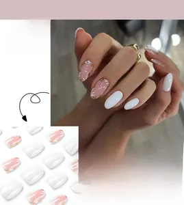 Detail of JP2582 white floral press-on nails with pink flower art and gold leaf accents