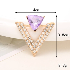 Golden V-shaped charm with clear rhinestones and a purple triangle gemstone detail