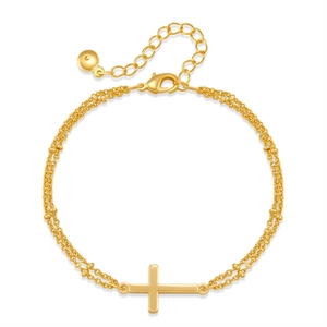Detail of a gold-plated double-layer bead chain bracelet with a minimal cross pendant