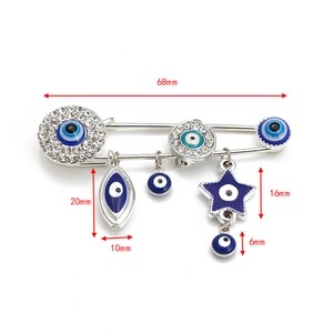 Detailed view of Turkish Evil Eye brooch with 68mm width dimensions and crystal charms