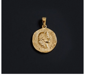 Detailed macro of 18K gold plated coin pendant with profile portrait and vintage engraving