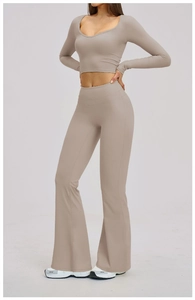 Detail of light brown brushed yoga set with open back long sleeve top and flared leggings