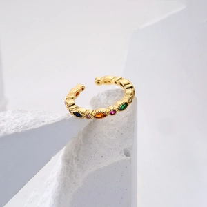 Detailed close-up of a gold-plated adjustable ring with colorful marquise zircons
