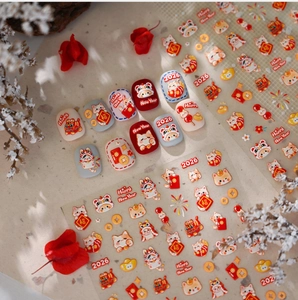 Detail of 3D embossed New Year nail stickers featuring Lucky Cat and gold ingots