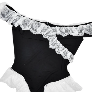Close-up of black body-con bodysuit featuring delicate white lace trim and contrast details