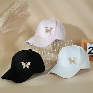 Detailed display of three baseball caps with rhinestone butterfly and jacquard pattern