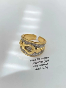 Detail of 18K gold plated brass ring with pavé crystals and buckle motif