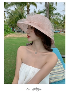 Detailed close-up of pink organza beach hat featuring elegant multi-layered floral ruffles