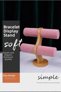 Double-tier bamboo jewelry stand with pink velvet bars for bracelets and watches