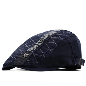 Dark blue cotton flat cap with diamond quilting, metal M logo and adjustable strap