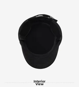Detail view of winter flat top hat interior featuring warm black fleece lining and stitching