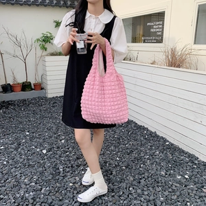 Detailed view of the pink 3D popcorn bubble texture on this stylish polyester shoulder bag
