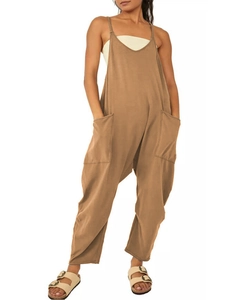 Detail view of baggy khaki jumpsuit with adjustable straps and large side utility pockets