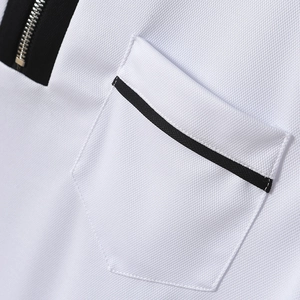 Detail of white mesh polo shirt showing metal zipper and black contrast pocket trim
