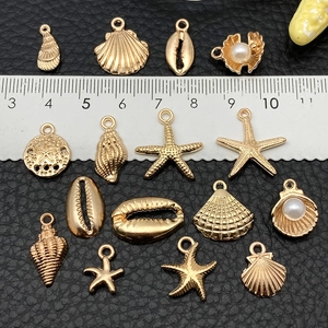 Gold KC shell and starfish ocean charms set for DIY jewelry making with size scale