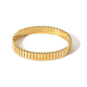 Polished 18K gold plated stainless steel oval bangle with hollow vertical stripe design