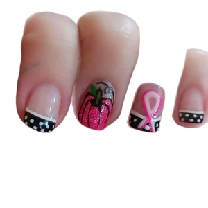 Pink ribbon and polka dot French press-on nails with glitter pumpkin patterns