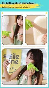 Pull-string green plush toy doll with a mechanical 360-degree rotating tail feature