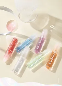 Close-up of clear roller-ball applicator on a moisturizing lip oil bottle set