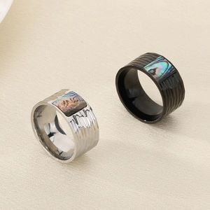 Hammered stainless steel wide band rings with abalone shell inlay in silver and black colors