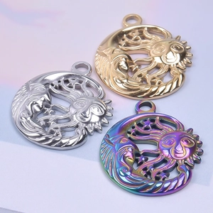 Detailed view of sun and moon pendants in gold, silver, and iridescent rainbow finishes