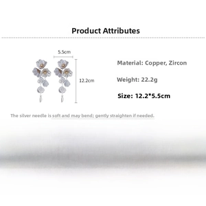 Detailed view of long flower earrings with cubic zirconia and copper dimensions 12.2*5.5cm