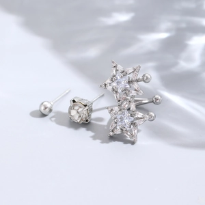 Elegant silver star earring set with sparkling cubic zirconia studs on a grey background
