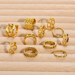 Set of 10 gold-plated stainless steel chain rings with minimalist woven and spiral textures