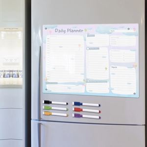 Close-up of magnetic acrylic daily planner on fridge with six colorful dry erase markers